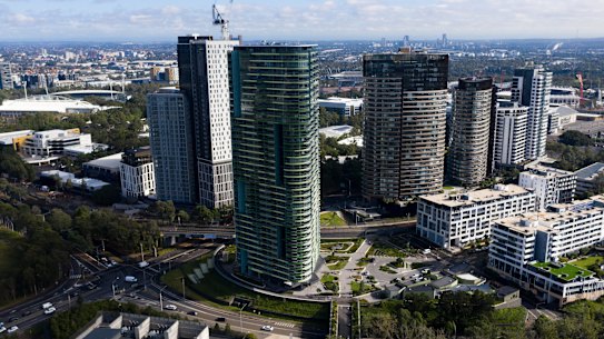 The evacuation of the Opal Tower, in the foreground, led to a shake up of building regulations. 