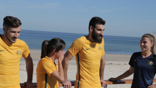 Former Socceroos captain Mile Jedinak with Matildas stars Lisa De Vanna and Steph Catley.