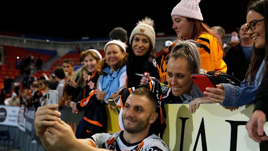 Robbie Farah takes a selfie with NRL fans.