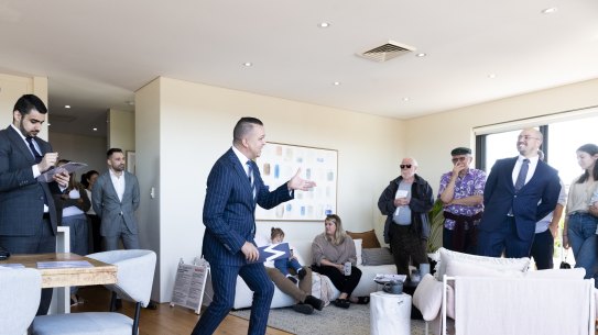 Auctioneer Clarence White in action at 25/40 Maria Street, Petersham.