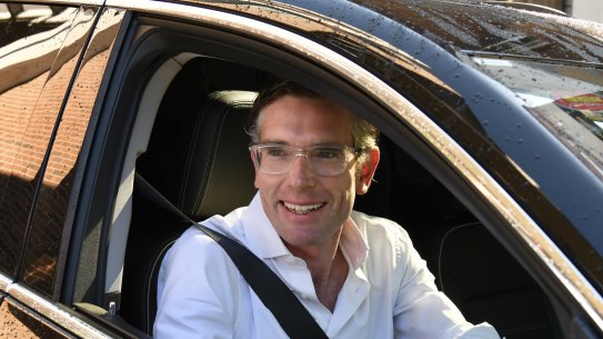 Dominic Perrottet heads to the local shops on Sunday. 