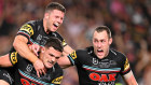 Nathan Cleary of the Panthers celebrates with teammates after scoring the match-winning try.