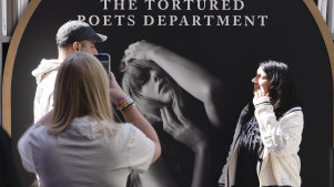Taylor Swift fans take selfies at a new pop-up opening to celebrate Taylor Swift’s upcoming album “The Tortured Poets Department,” at the Grove in Los Angeles on Wednesday, April 17, 2024. (AP Photo/Richard Vogel)
