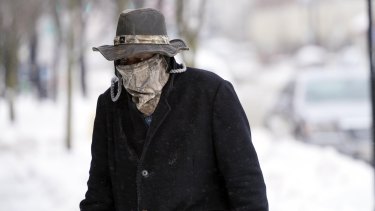 A pedestrian wears a face mask to protect him from the cold in Pittsfield, Massachusetts, this week.