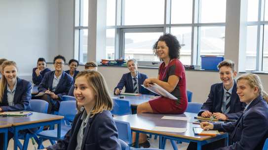 High school students and their teacher. 