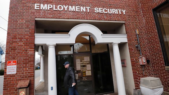 A man walks away from a locked door at the New Hampshire Employee Security centre, which handles unemployment claims, in Manchester, NH,