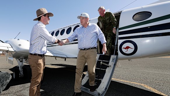 Prime Minister Scott Morrison is greeted at Quilpie airport by David Littleproud.
