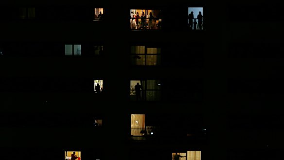 People applaud from their houses in support of the medical staff that are working in Rivas Vaciamadrid. 