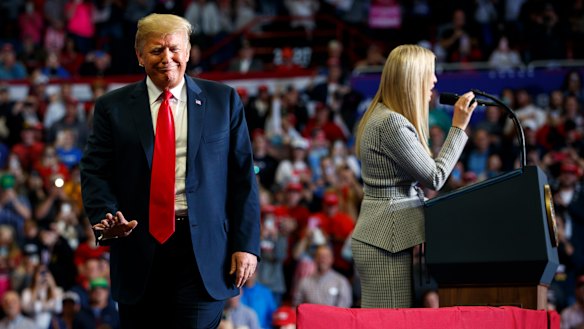 President Donald Trump waves as his daughter Ivanka speaks at a rally. He turned Clinton's use of a private email address against her.