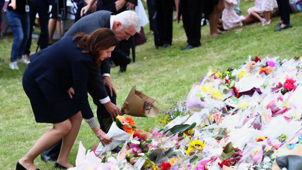 Premier Annastacia Palaszczuk and MP Joe Kelly lay flowers during the vigil for Hannah and her children in February.