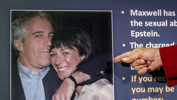 A US attorney points to a photo of millionaire Jeffrey Epstein and British socialite Ghislaine Maxwell during a news conference last year.