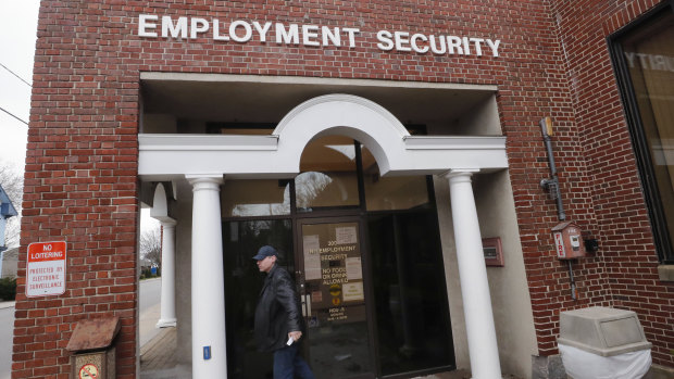 A man walks away from a locked door at the New Hampshire Employee Security centre, which handles unemployment claims, in Manchester, NH,
