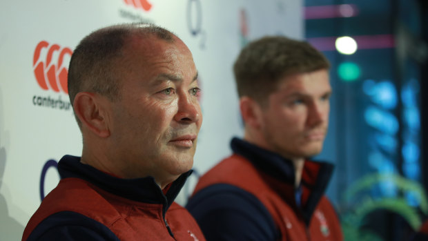 Jones is flanked by England captain Owen Farrell before the Six Nations opener.