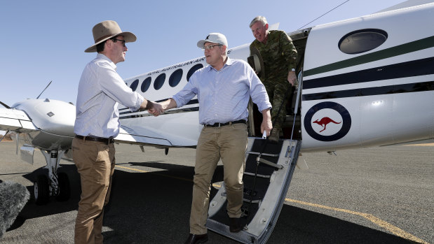 Prime Minister Scott Morrison is greeted at Quilpie airport by David Littleproud.