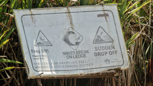 Warning signs at Devil's tears advising tourists about the dangers of the powerful waves. 