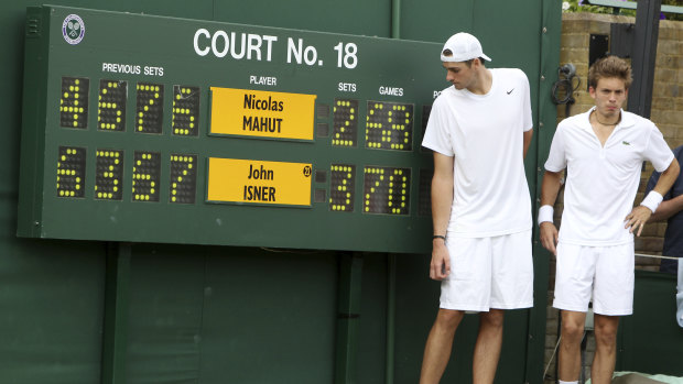 New balls please:  John Isner and Nicolas Mahut went to the absurd lengths of 70-68 in the final set of their epic match at Wimbledon in 2010..