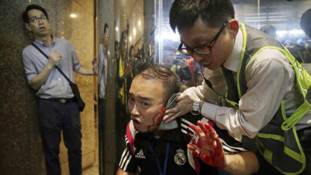 District councilor Andrew Chiu receives medical treatment in Hong Kong after the attack. 