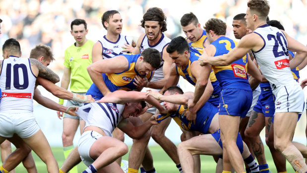 Smash-up Derby: West Coast and Fremantle player scuffle during their round 20 clash at Optus Stadium.