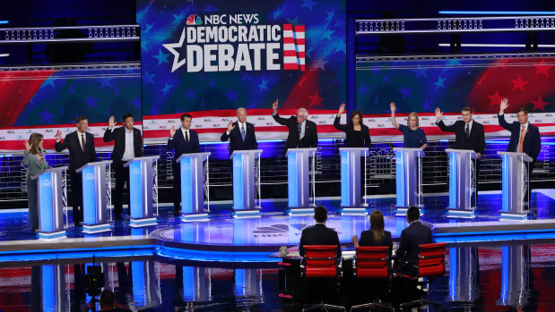 Democratic presidential candidates raise their hands when asked if they would provide healthcare for undocumented immigrants.