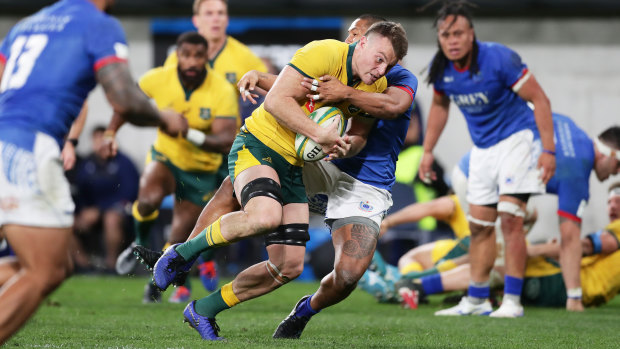 Jack Dempsey carries the ball in Australia's 34-15 win over Samoa on Saturday night. 