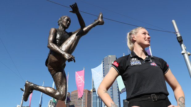 Tayla Harris poses with the statue unveiled in Federation Square this week.