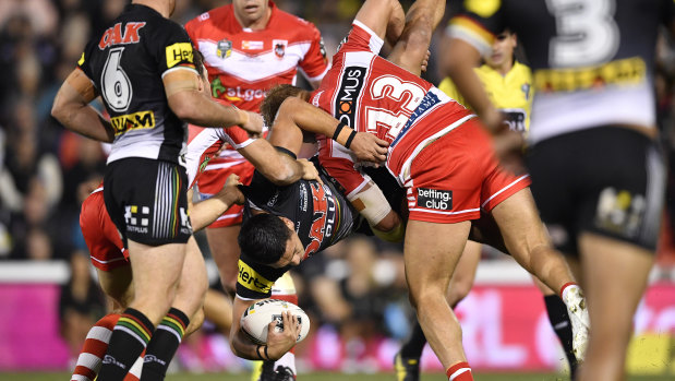 Above and beyond: Jack de Belin lifts Dallin Watene-Zelezniak in a tackle, for which he escaped sanction. 