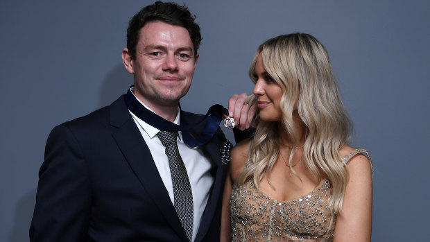 Lachie Neale of the Lions poses with his wife Jules after winning the Brownlow Medal.