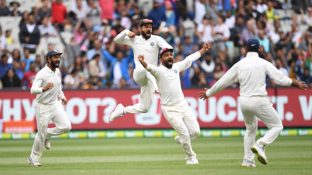 India's players celebrate their MCG win.