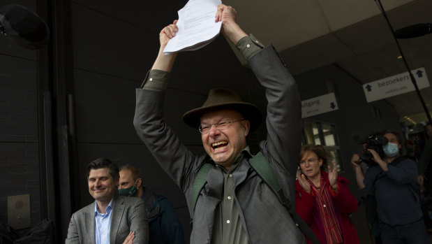 Environmentalists celebrate the outcome of the court case between the Dutch arm of the Friends of the Earth environmental organisation and Shell in The Hague, Netherlands.