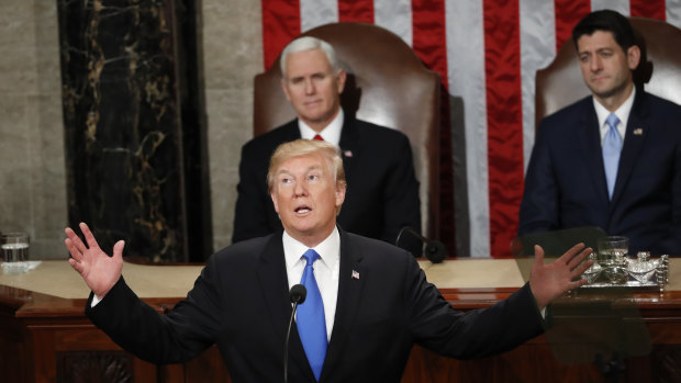 US President Donald Trump at the address last year. This time, a Democrat will be sitting over his shoulder.