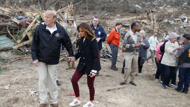 Donald Trump and Melania in Alabama with tornado victims.