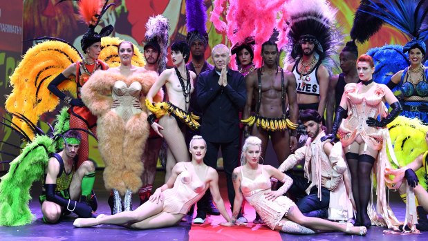 Jean Paul Gaultier with the cast of his revue at Paris’s Folies Bergère. “I would pick girls I saw in clubs in London and Paris,” he says.