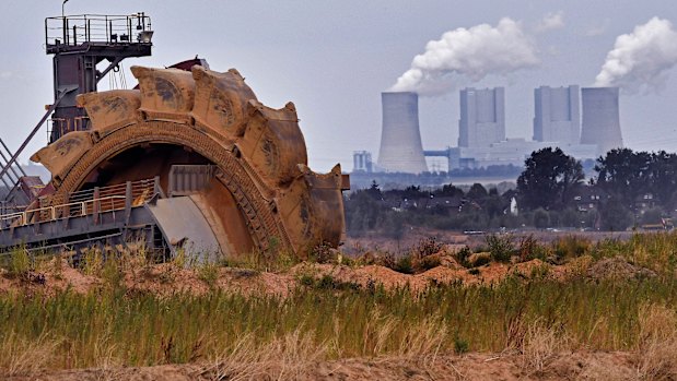 A bucket wheel digs for coal near the Hambach Forest near Dueren, Germany.