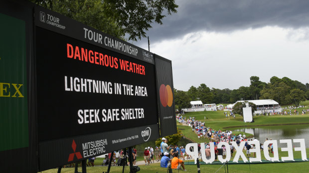 Storm warning: A sign warns of inclement weather after a delay was called during the third round of the Tour Championship golf tournament. 