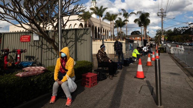 People line up near Lakemba Mosque to receive their vaccinations at a pop up clinic at the Muslim Women Association. 