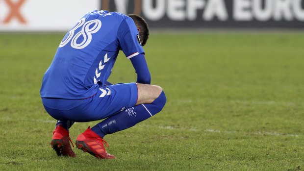 Rangers' Kyle Lafferty is dejected after losing to Rapid Vienna.