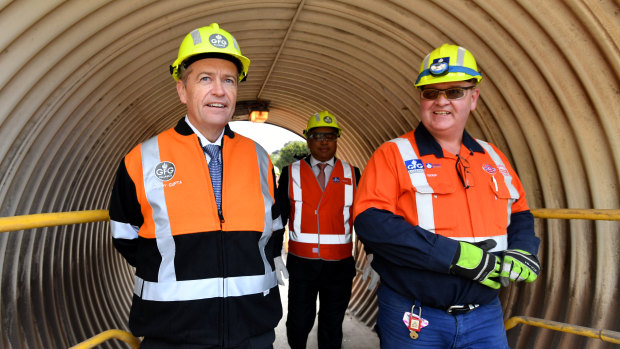 Bill Shorten - visiting a steel works in Whyalla, South Australia on Wednesday - is under pressure to reveal the costs of his climate change policy.