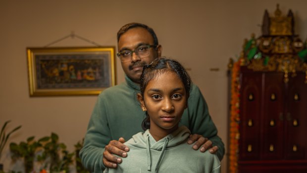 Eleven-year-old student Prisha Kumar with her father Vijay Kumar. Prisha was caught in the selective school fiasco in May.