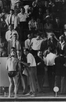 The injured Hungarian Ervin Zador (left) talks to the referee (holding his arm) after the incident 