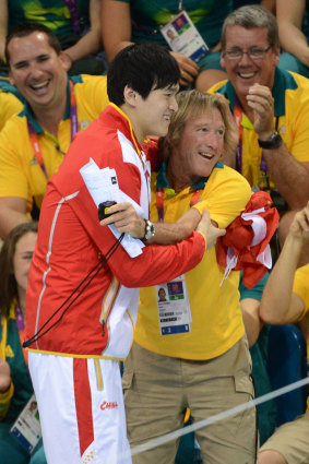 China’s Sun Yang hugs Australian coach Denis Cotterell.