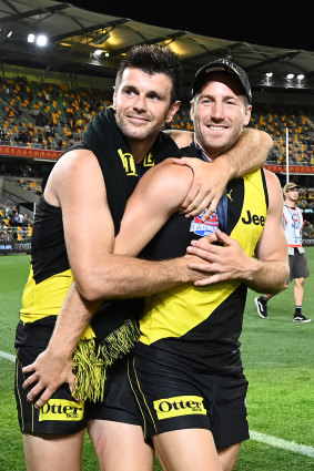 Trent Cotchin, pictured left with Kane Lambert after Richmond’s 2020 grand final win, was a revered captain.