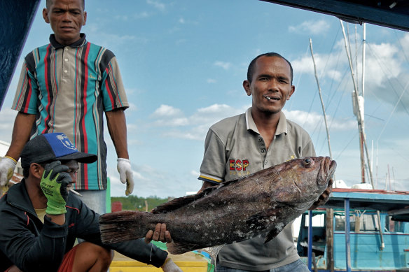 Dedi, a fisherman and resident of the Natuna Islands, with his catch.