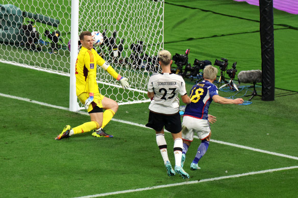 Takuma Asano of Japan scores his team’s second goal against Germany.