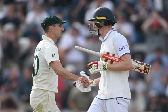 Pat Cummins congratulates Zak Crawley on his century.