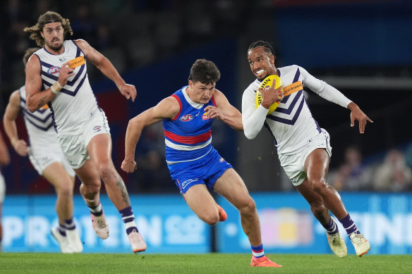 Brandon Walker of the Dockers runs with the ball.