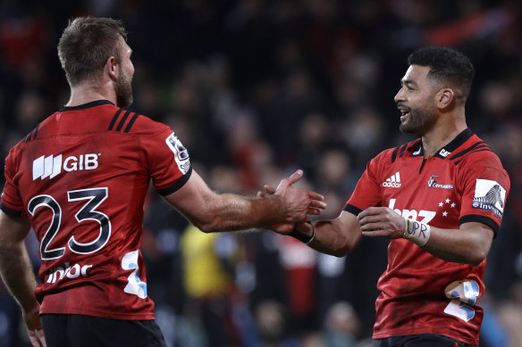 Crusaders Richie Mo'unga, right, and teammate Braydon Ennor after defeating the Hurricanes in their Super Rugby semi-final in Christchurch last year.