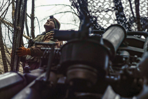 A Ukrainian soldier looks at the sky searching for Russian FPV drones.