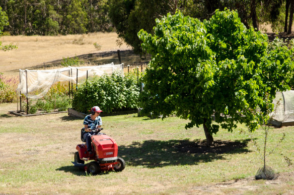 Probert mowing the lawns at her Otways property.
