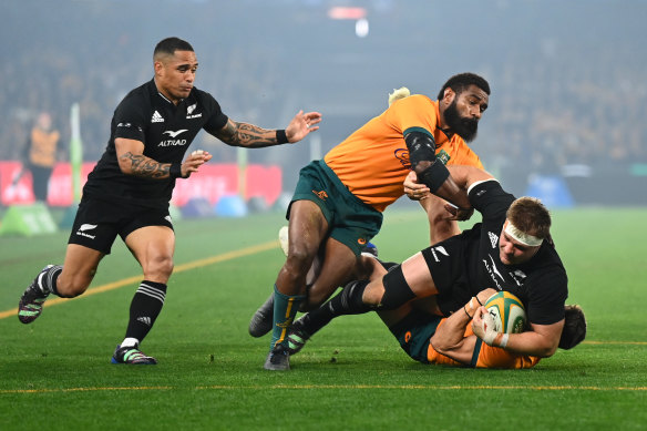 Sam Cane charges forward for the All Blacks.