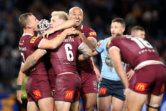 The Maroons celebrate on Wednesday night.